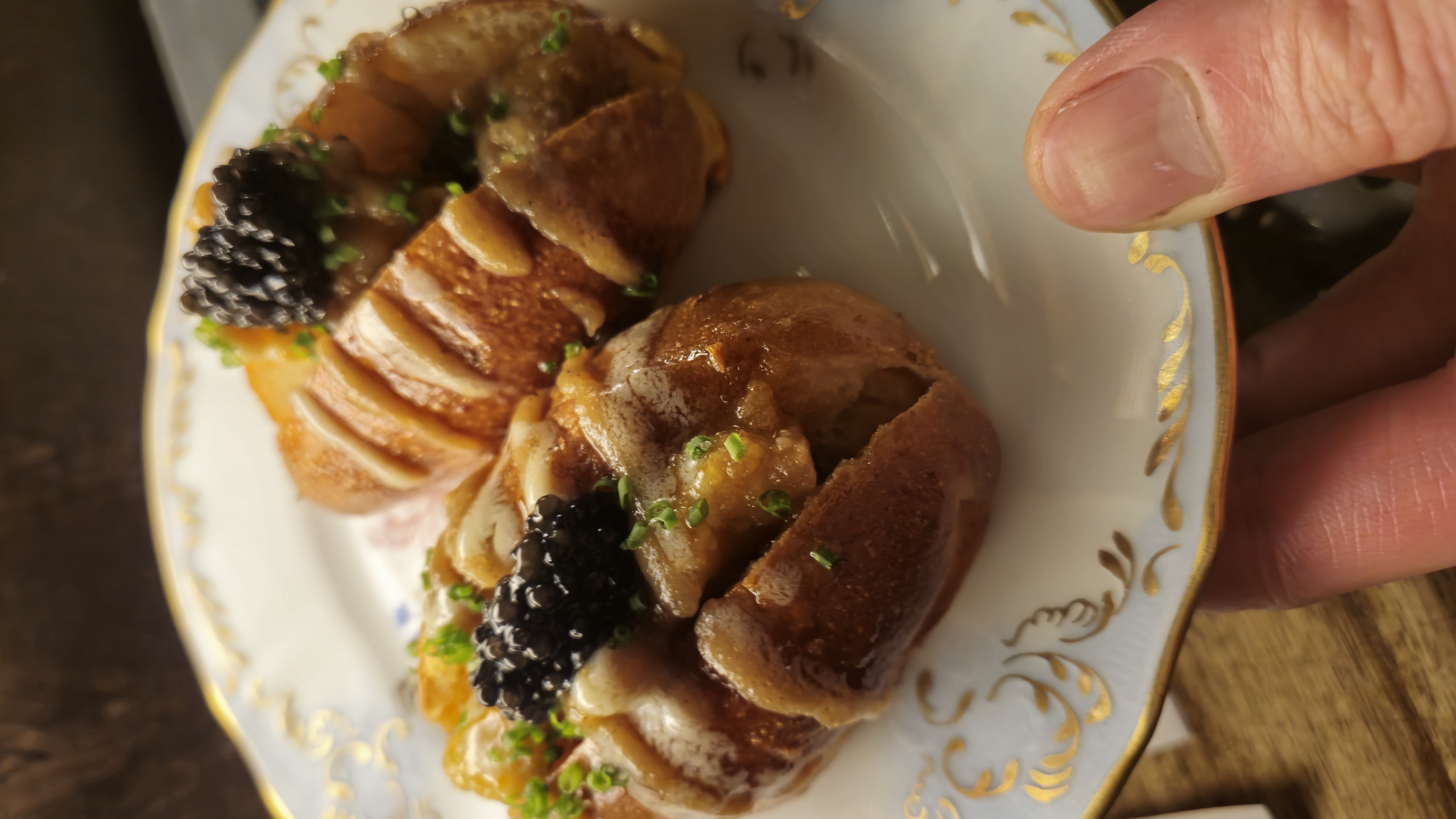 Glazed brioche bites with caviar and chives