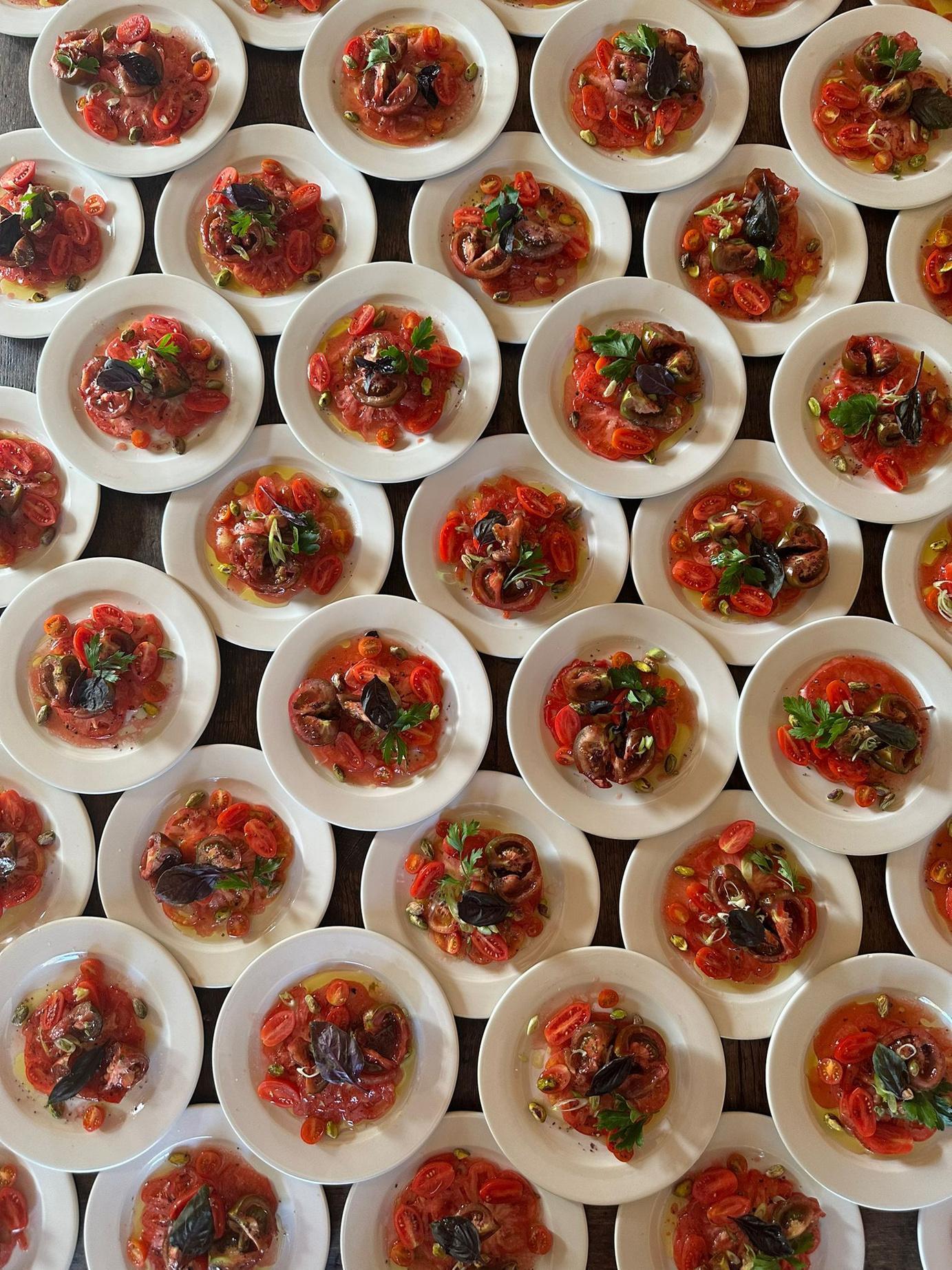 Tomato and shellfish plates arranged in a grid